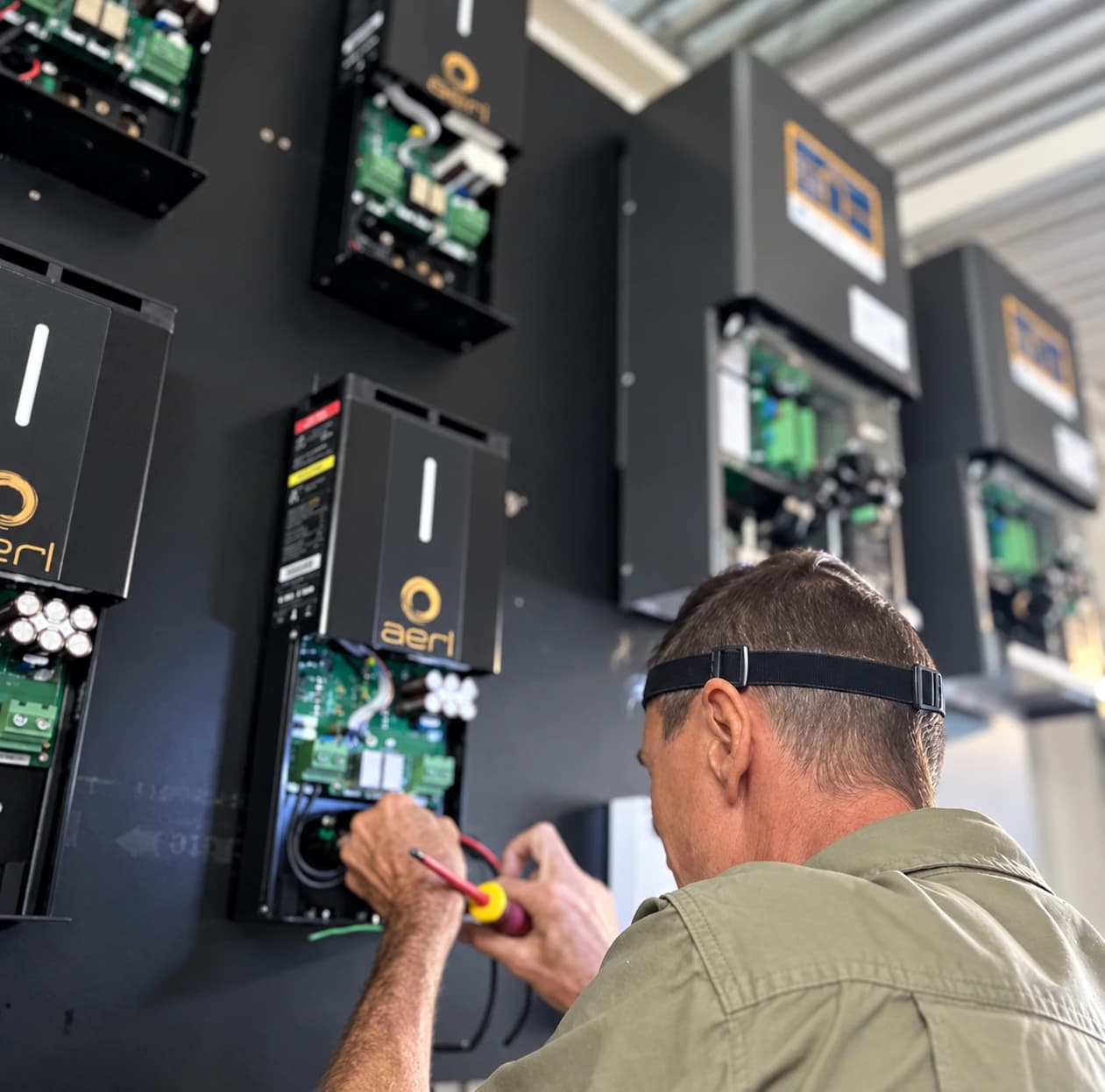 Technician working on AERL power electronics